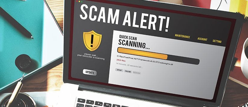 laptop displaying scam alert after opening gmail