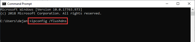 Running the command to flush DNS cache in Windows.