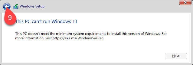 Returning to the installation process by clicking the back arrow in the Windows 11 installer.