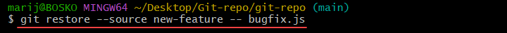 Checking out a file in Git using git restore.